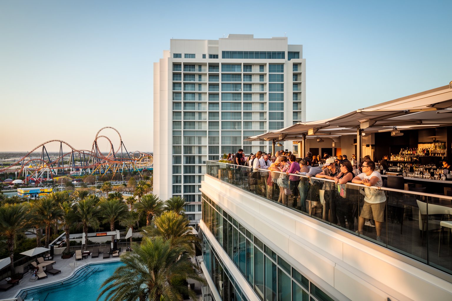 Universal Studios Florida Hotels: Hidden Gems Compared Modern glass tower and rooftop terrace at Universal's Aventura Hotel
