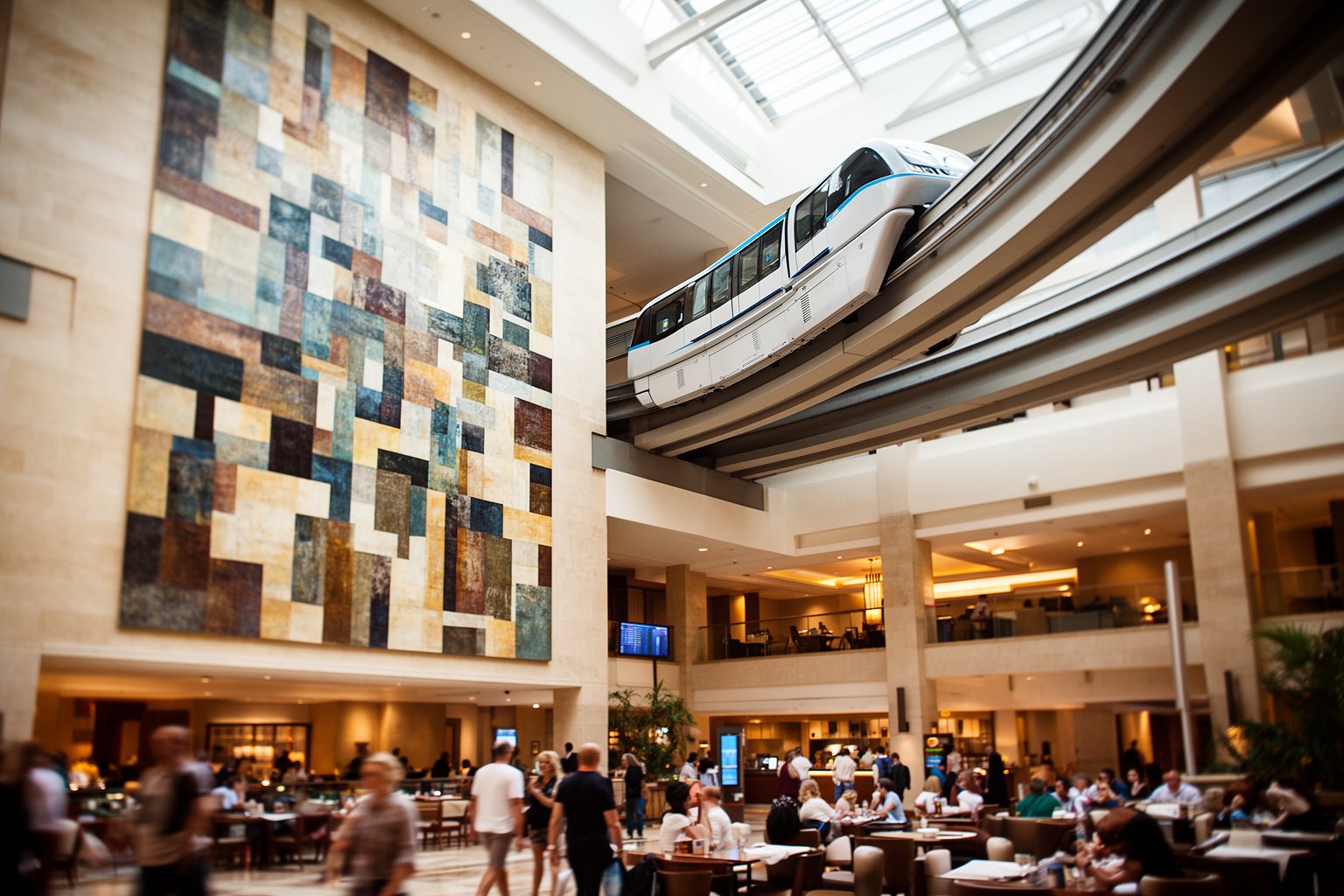Discover the Magic: Top 10 Disney World Orlando Hotels You Must Visit! Monorail gliding through the open concourse of Disney's Contemporary Resort