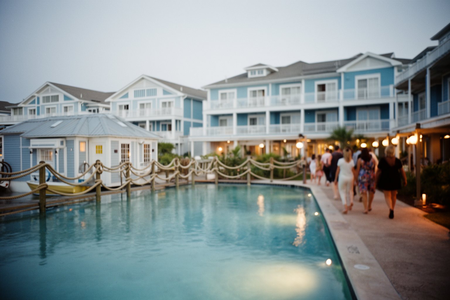 Universal Studios Florida Hotels: Hidden Gems Compared Coastal-style buildings and pool at Universal's Dockside Inn and Suites in the evening