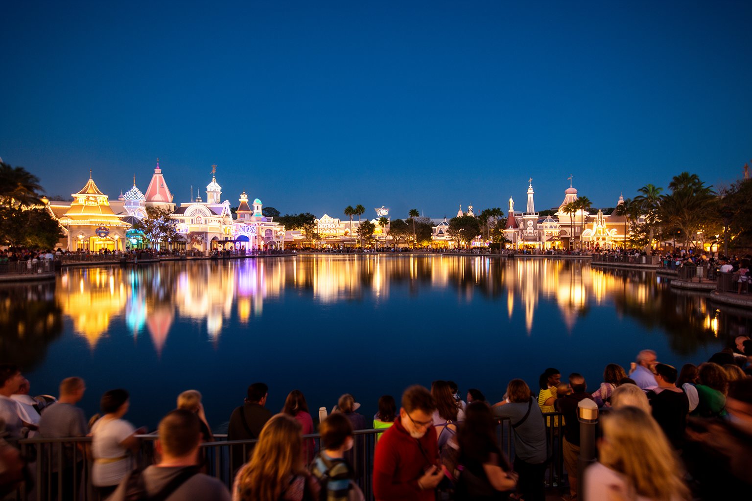 Epcot Orlando Guide: World Showcase, Rides and Festivals Epcot's illuminated pavilions reflected in the World Showcase Lagoon at night