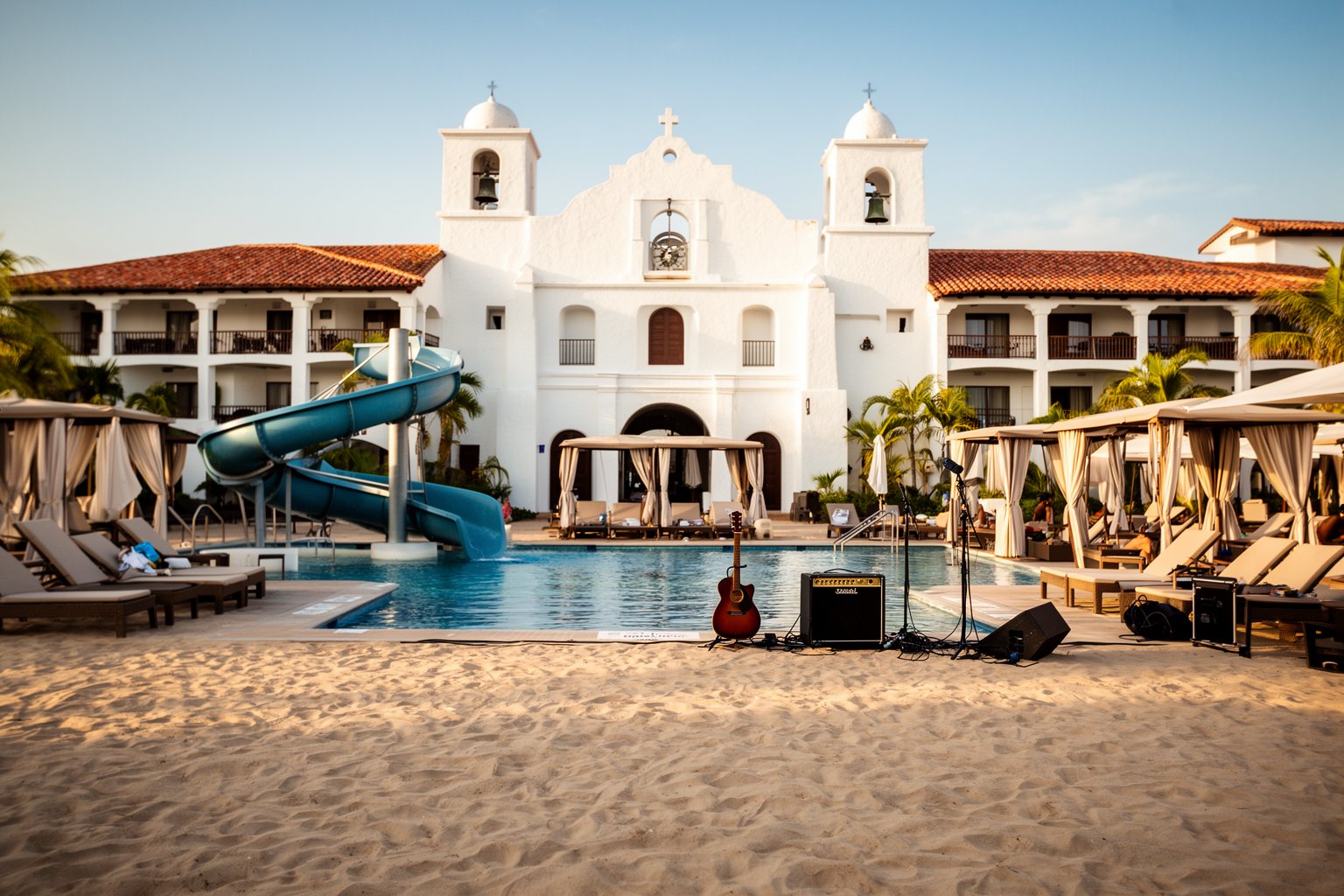 Universal Studios Florida Hotels: Hidden Gems Compared Mission-style Hard Rock Hotel and its sand-beach pool at Universal Orlando