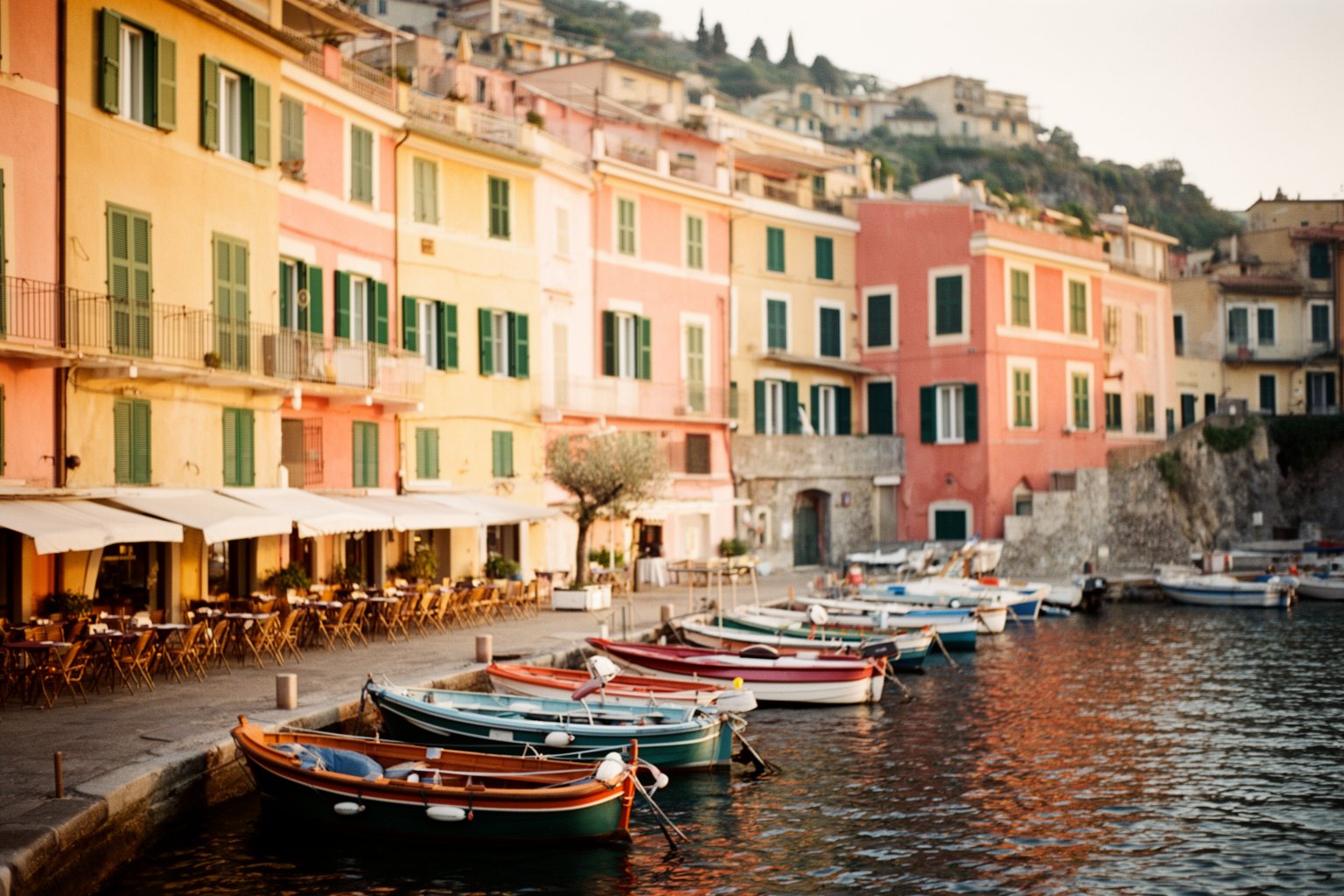 Universal Studios Florida Hotels: Hidden Gems Compared Pastel harbour-front facades of Loews Portofino Bay Hotel at golden hour