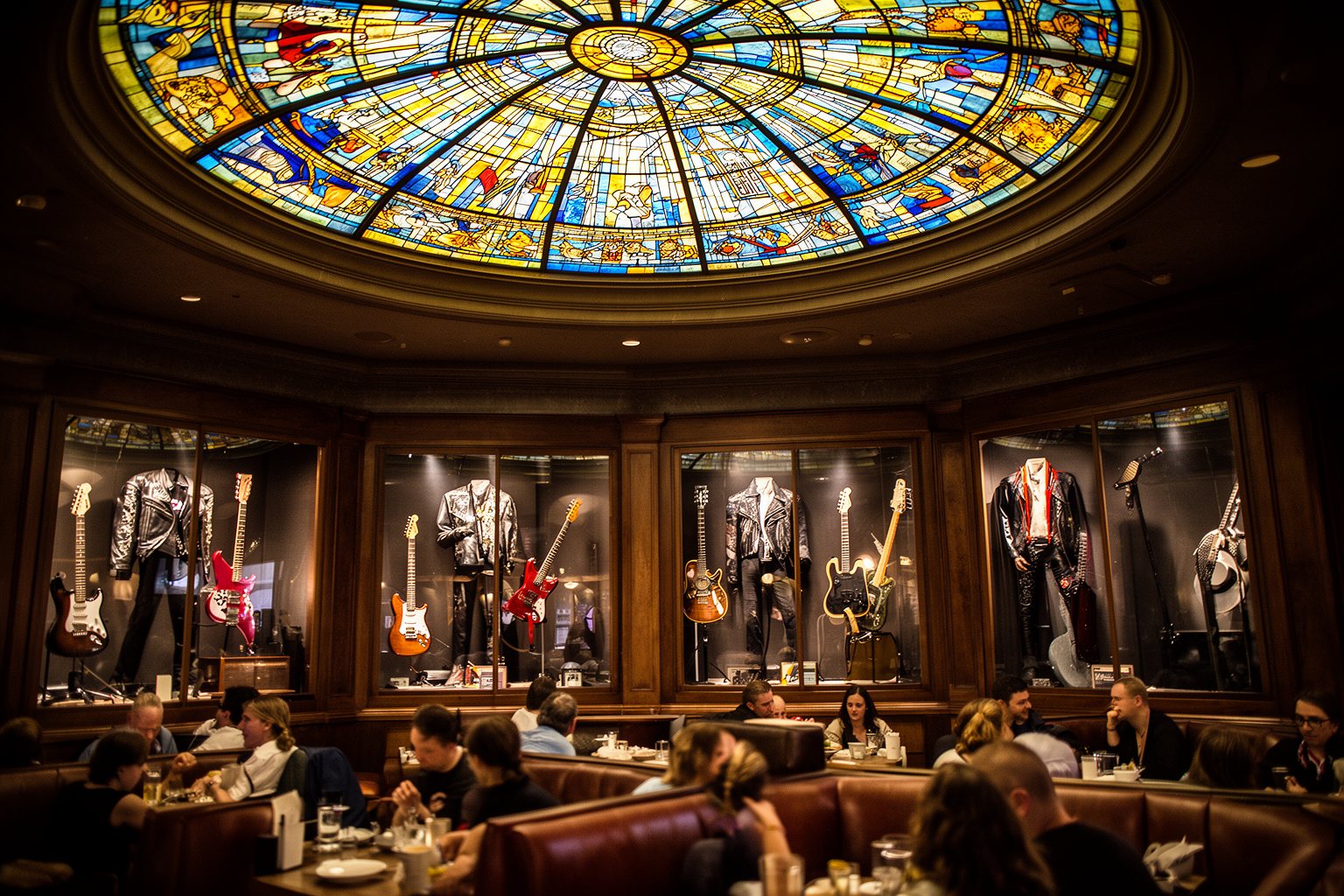 10 Must-Try Restaurants at Universal Studios Florida: Your Ultimate Guide Guitars and stage memorabilia on the walls inside Hard Rock Cafe Orlando