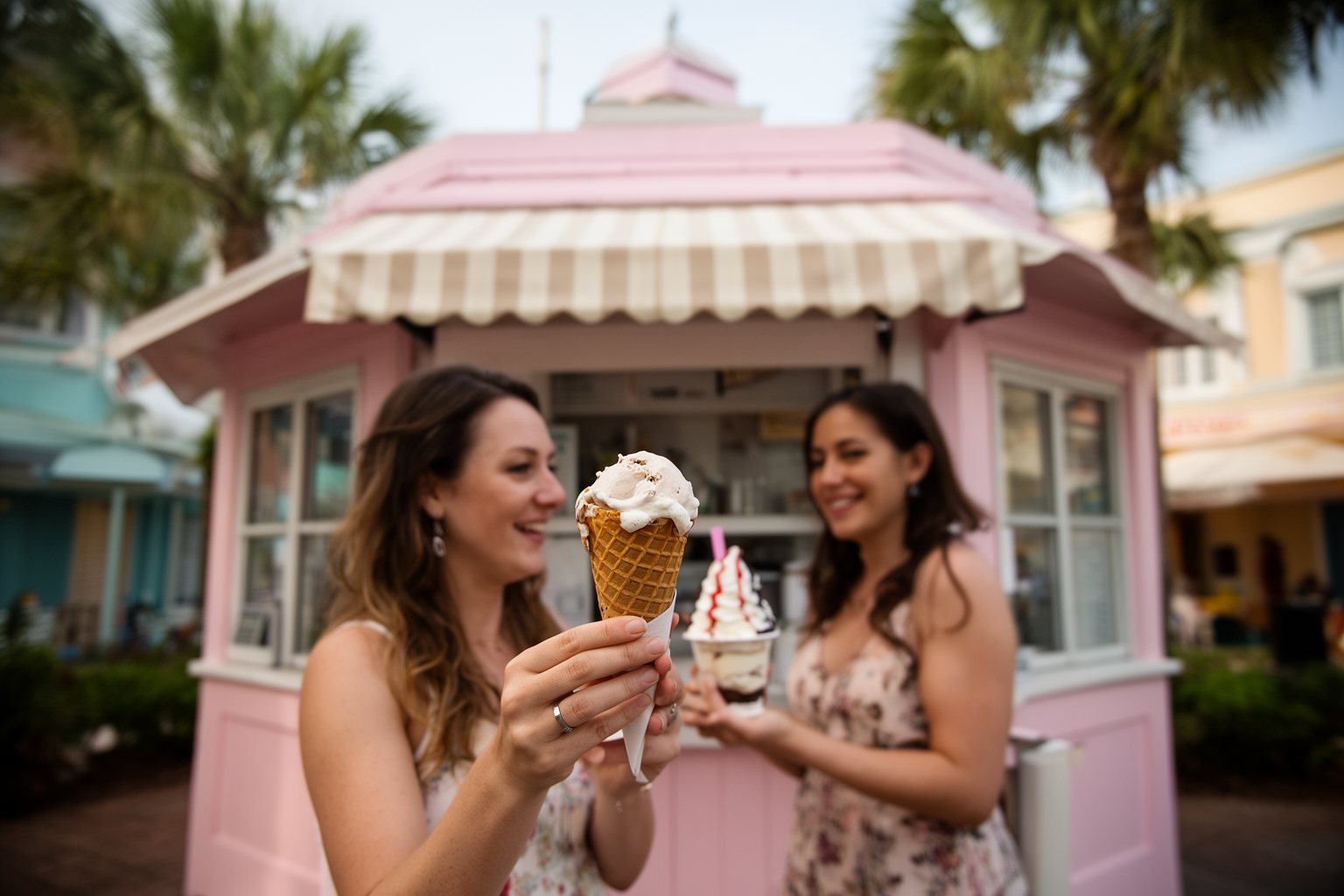 Hollywood Studios Food Spots: Where to Eat Like a Star Friends with ice cream cones outside a 1940s-style ice cream stand on Sunset Boulevard