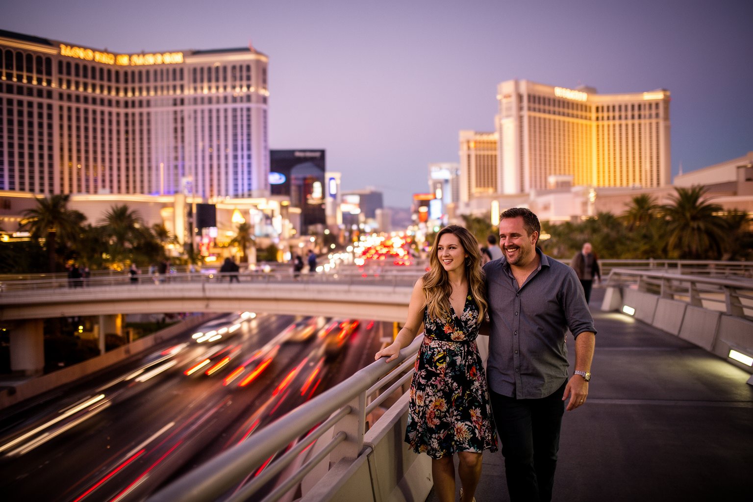 Vegas Nightlife Guide: Clubs, Shows, Casinos and Late Eats Couple dressed for a night out crossing a pedestrian bridge above the Las Vegas Strip at dusk