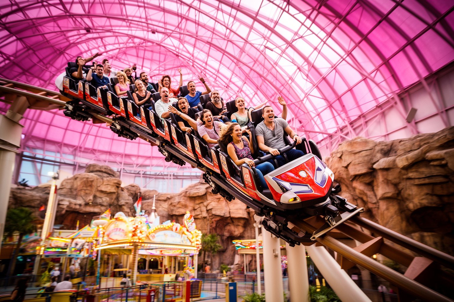 Circus Circus Las Vegas: Casino, Adventuredome and Acts Riders on a roller coaster under the pink glass dome of the Adventuredome at Circus Circus Las Vegas
