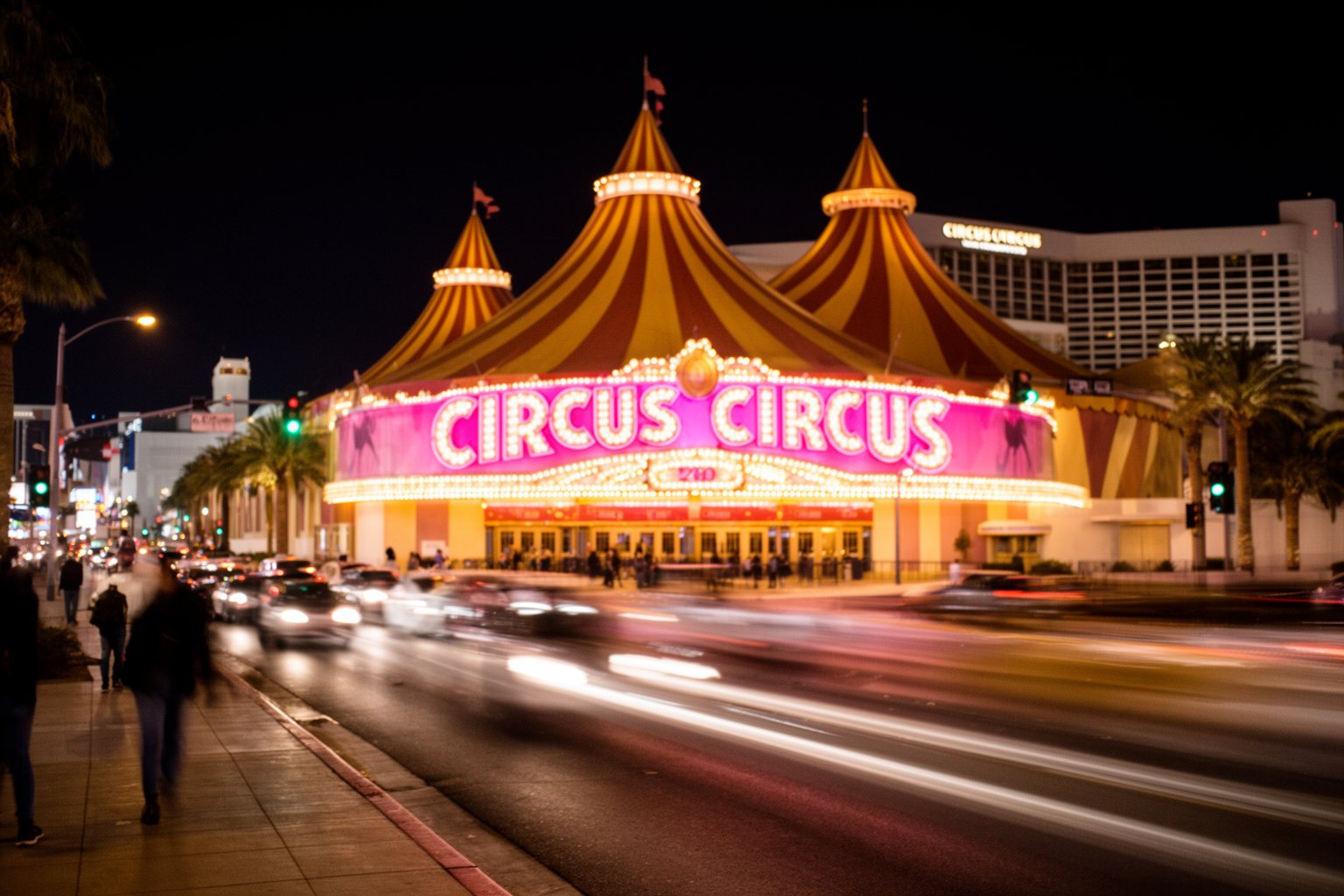 Circus Circus Las Vegas: Casino, Adventuredome and Acts Circus Circus resort glowing at night seen from the Las Vegas Strip sidewalk