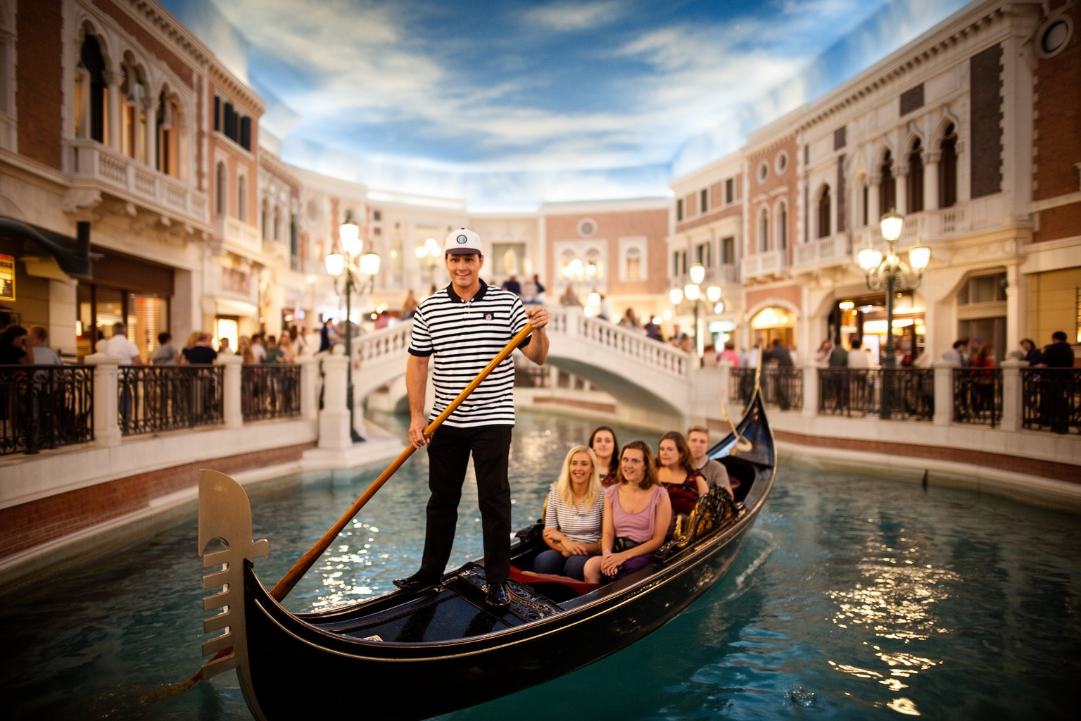 Your Family’s Perfect Home Base: Child-Friendly Hotels in Vegas Family on a gondola ride along the indoor canal at The Venetian in Las Vegas