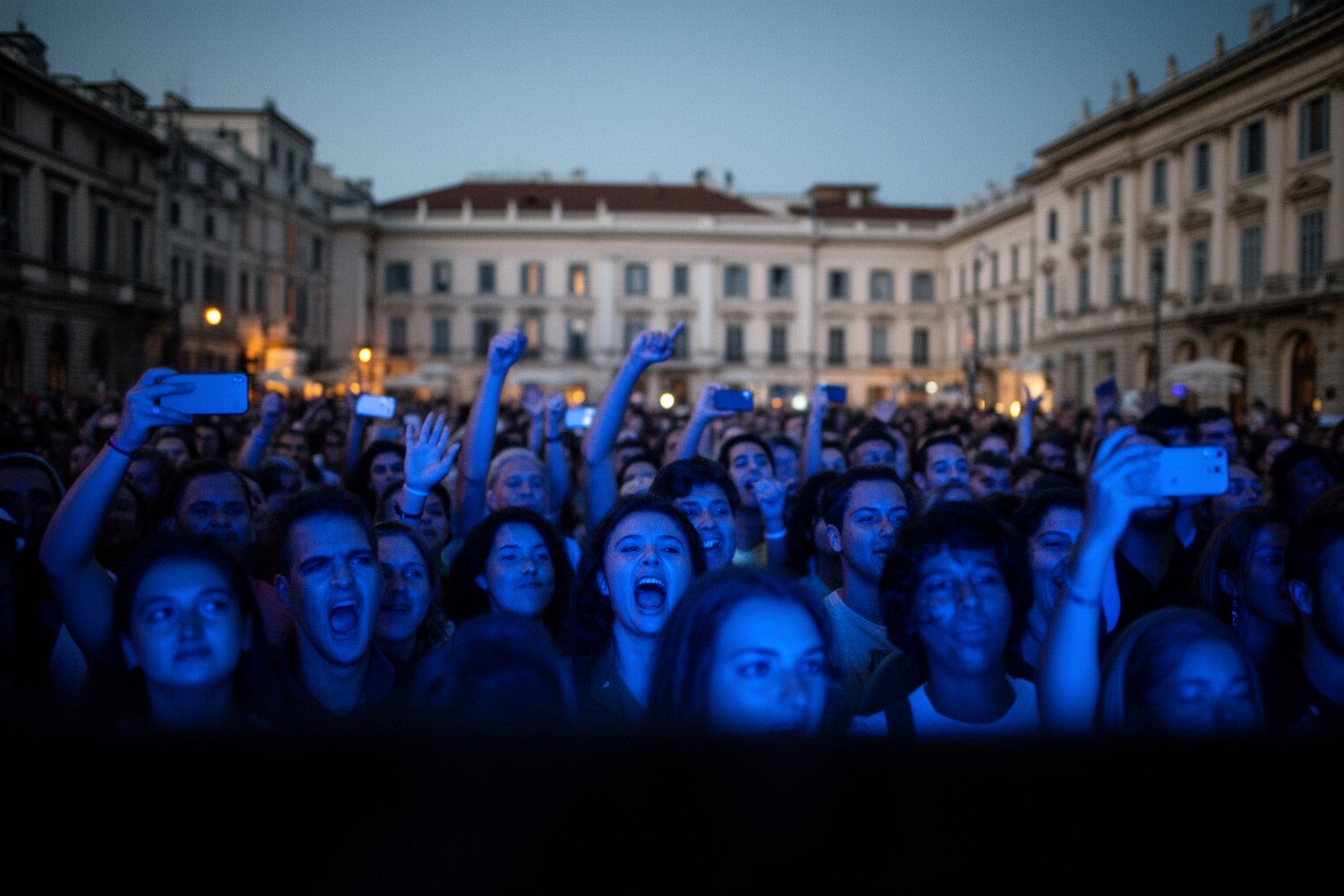 Star-Politicos: Is Mixing Celebrities and Politics a Ticking Time Bomb? Crowd in a city square watching election coverage on a large outdoor screen at night