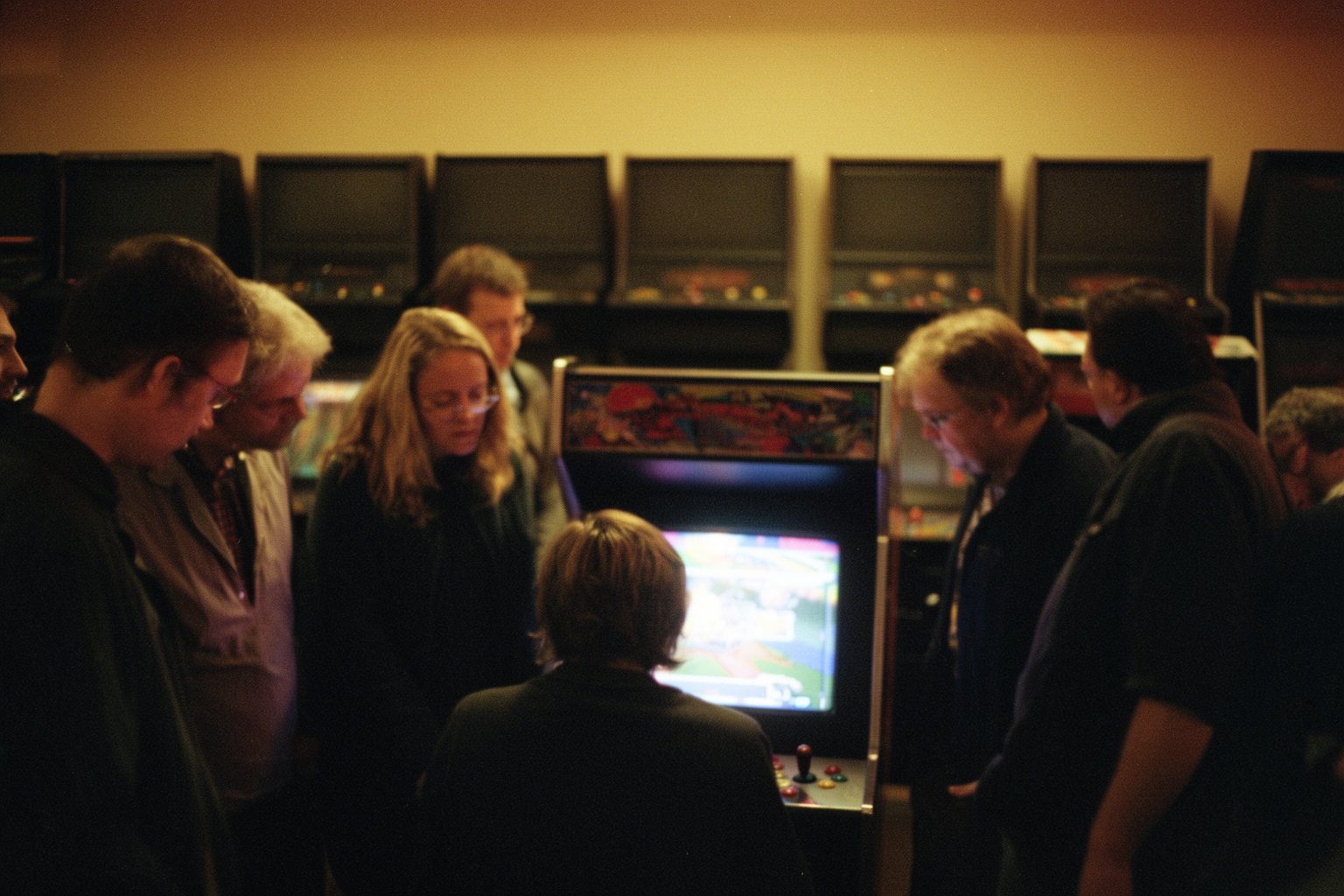 The Esports Industry: How Pro Gaming Became a Goldmine Crowd watching a player at a retro arcade game competition