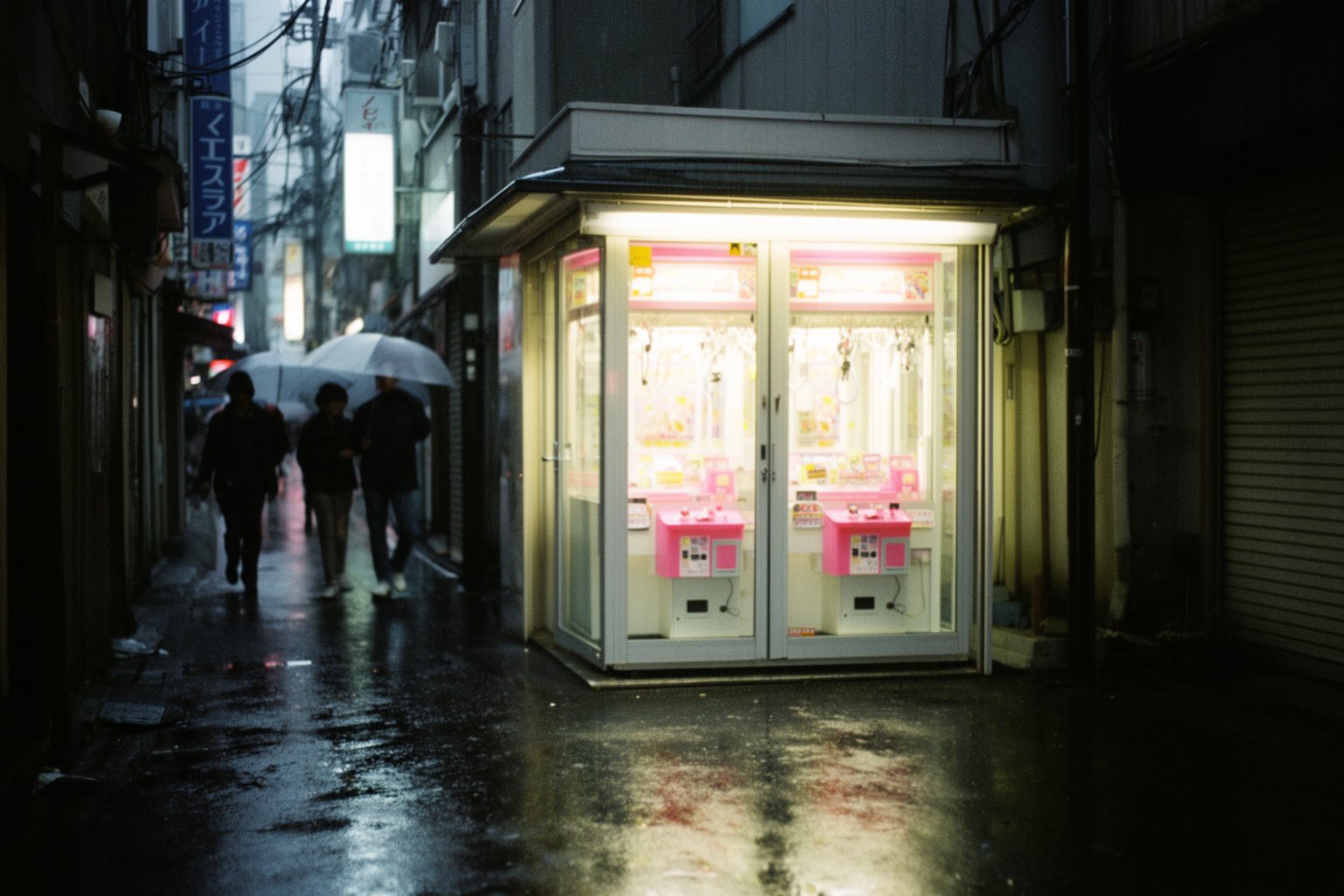 Gaming Cafes in Tokyo: Akihabara and Hidden Gems Game center with crane machines on a rainy Tokyo side street at night